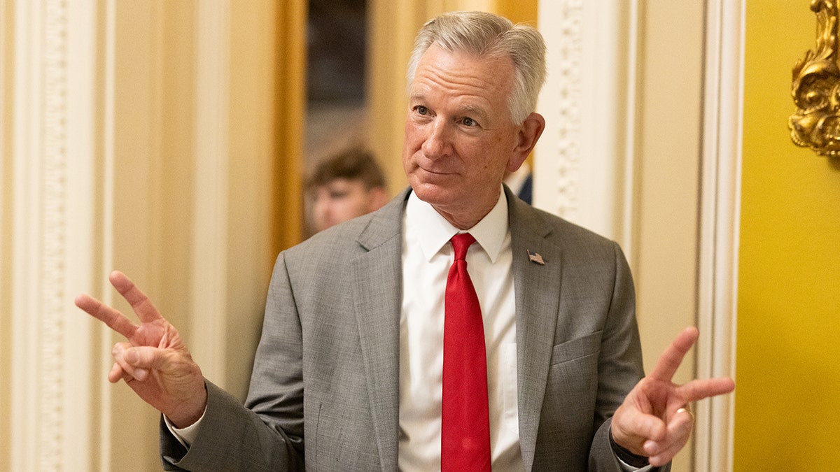 Sen. Tommy Tuberville flashing V signs
