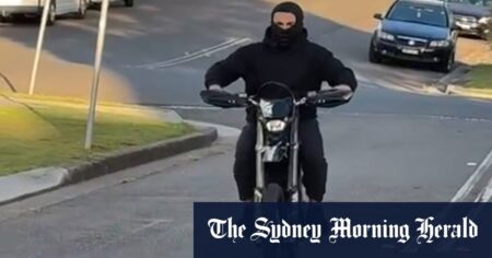 A 14-year-old boy riding his e-bike without a helmet.