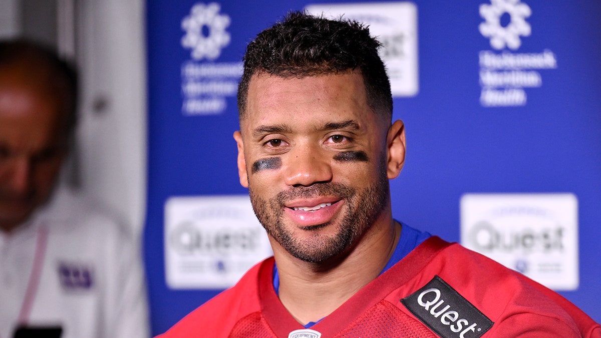 Russell Wilson looks on