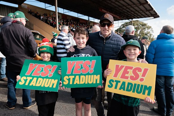 Stadium fans Hudson, Noah and Jack with Jack’s dad Aaron Hilda at the start of a march on Saturday in support of Hobart’s proposed AFL stadium.