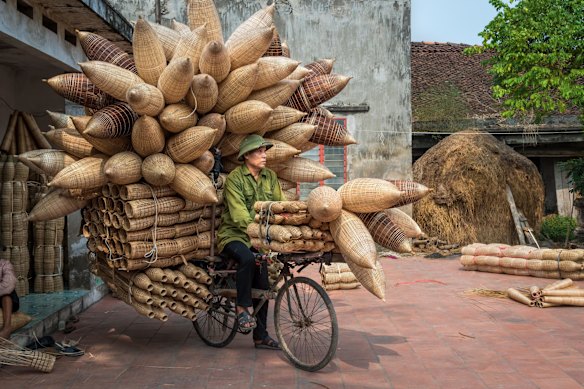 Bicycles have many uses in Vietnam.