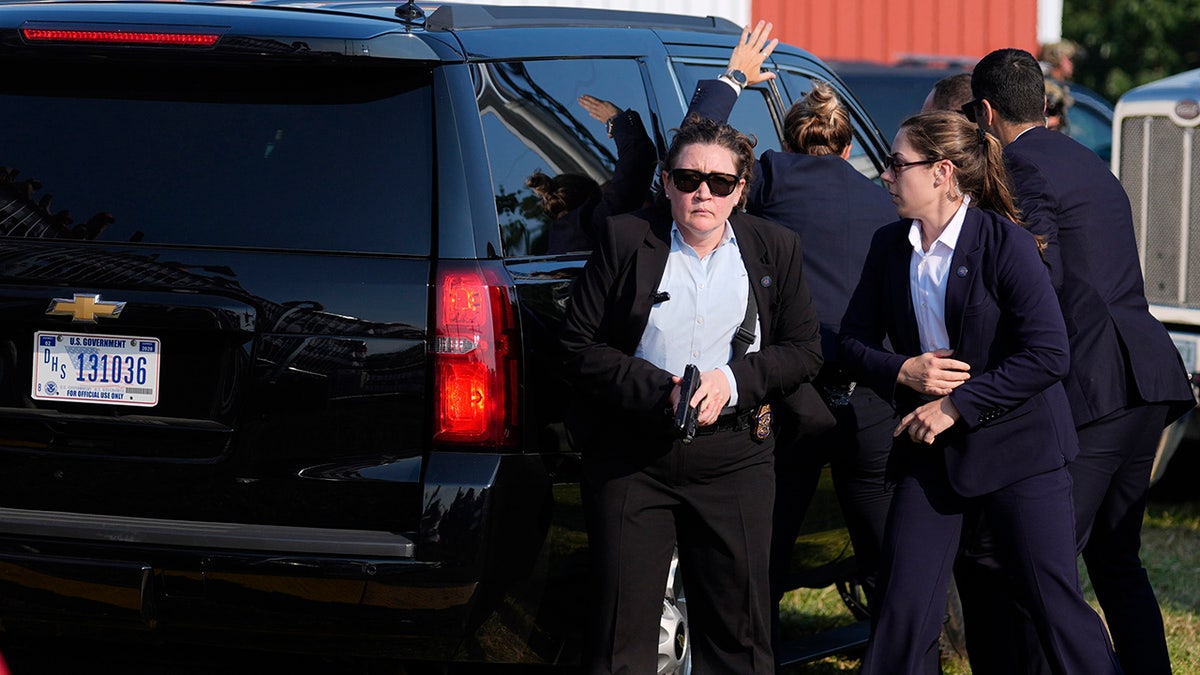 Secret Service agents surround Trump's vehicle