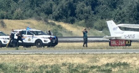 Incident at Vancouver airport temporarily halts flights, police seen on runway
