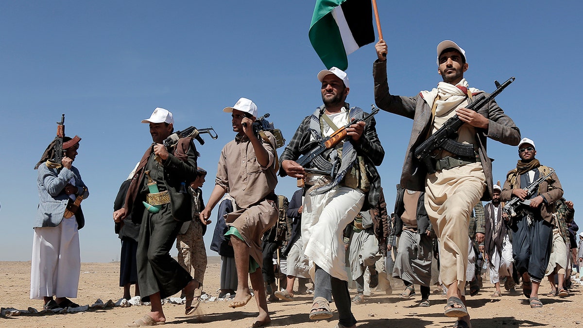 Houthi rebel fighters march during a rally of support for the Palestinians in the Gaza Strip and against the U.S. strikes on Yemen outside Sanaa on Jan. 22, 2024.
