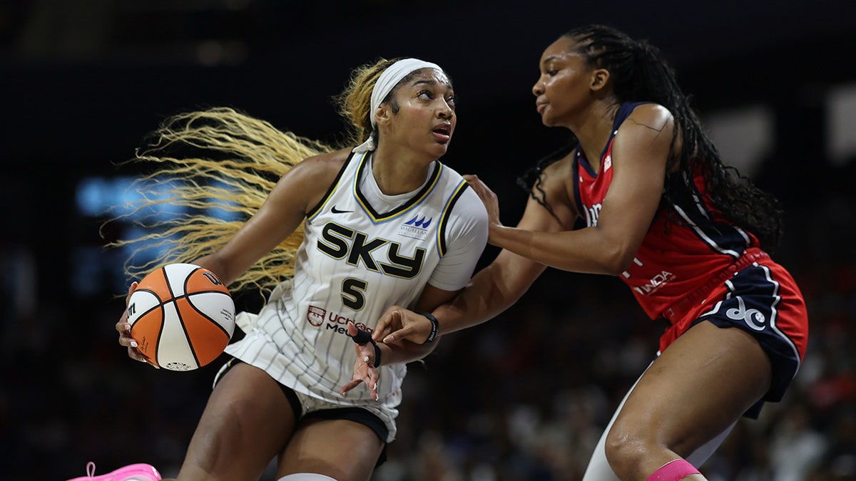 Angel Reese drives to the basket