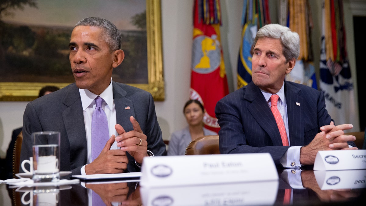 President Barack Obama, accompanied by Secretary of State John Kerry, meets with veterans and Gold Star Mothers to discuss the Iran Nuclear deal, Thursday, Sept. 10, 2015, in the Roosevelt Room at the White House in Washington. (AP Photo/Andrew Harnik)