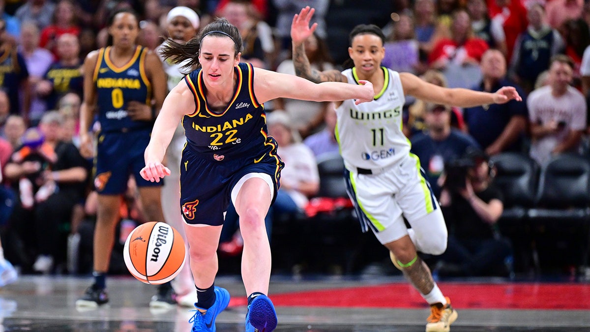 Caitlin Clark runs for the ball
