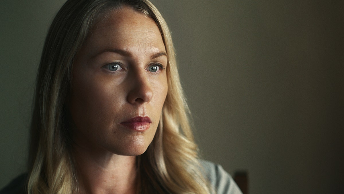 A close-up of Denise Huskins looking serious.