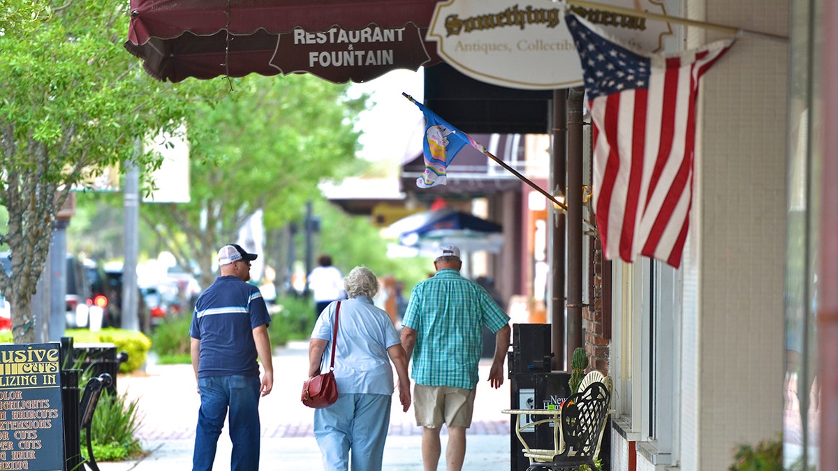 People walking down street in downtown Sanford, Florida