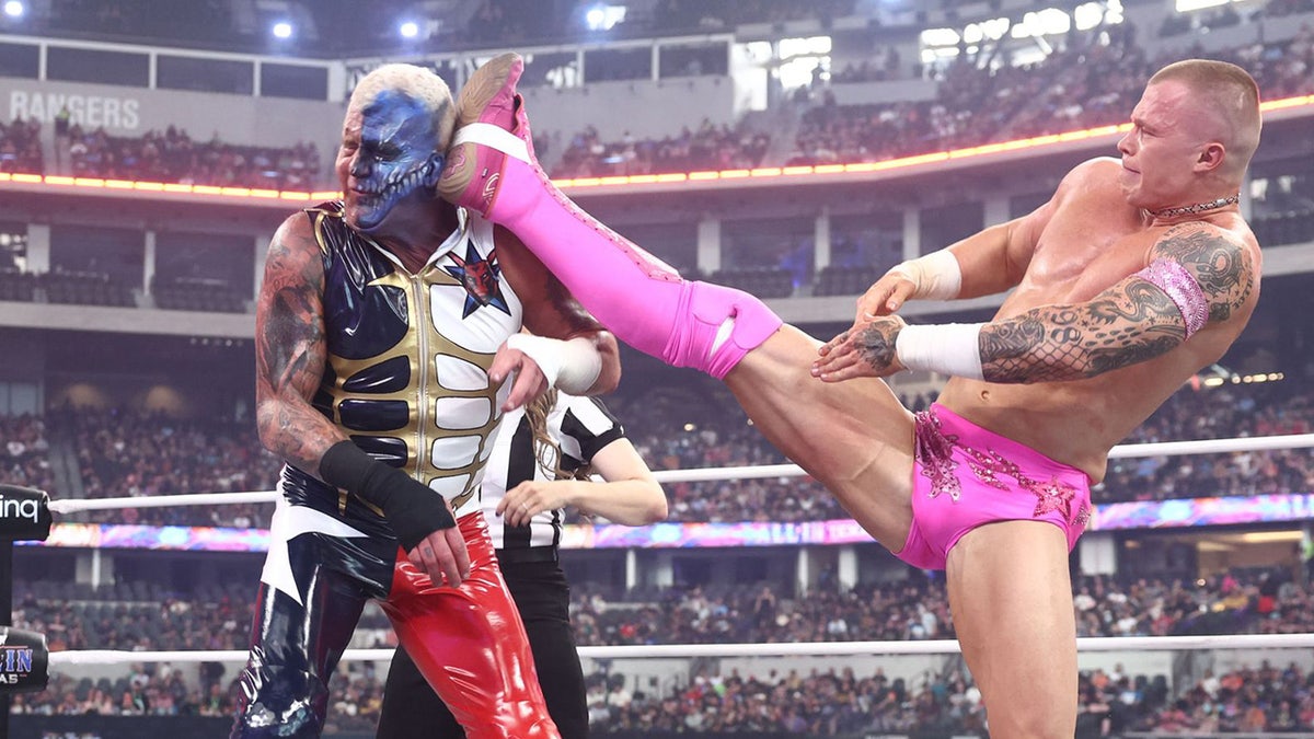 Kyle Fletcher kicks Dustin Rhodes