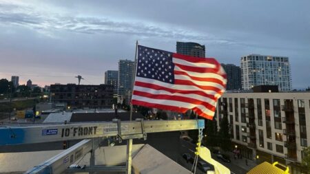 Patriotic ICE officer replaces American flag after protesters burned existing banner at Portland facility