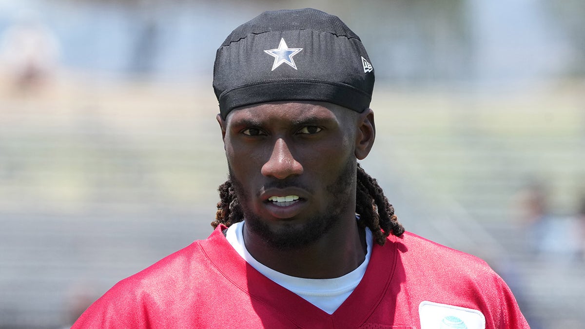 Joe Milton looks on