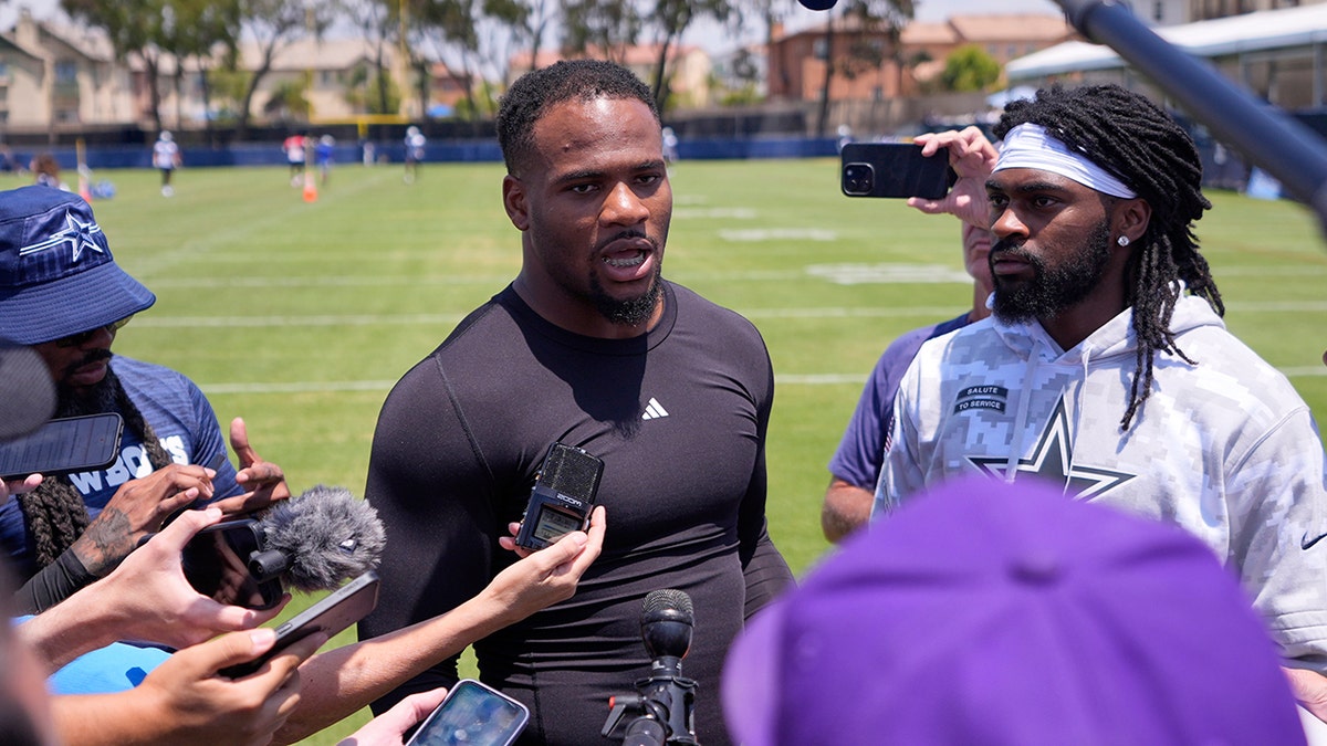 Micah Parsons talks to reporters