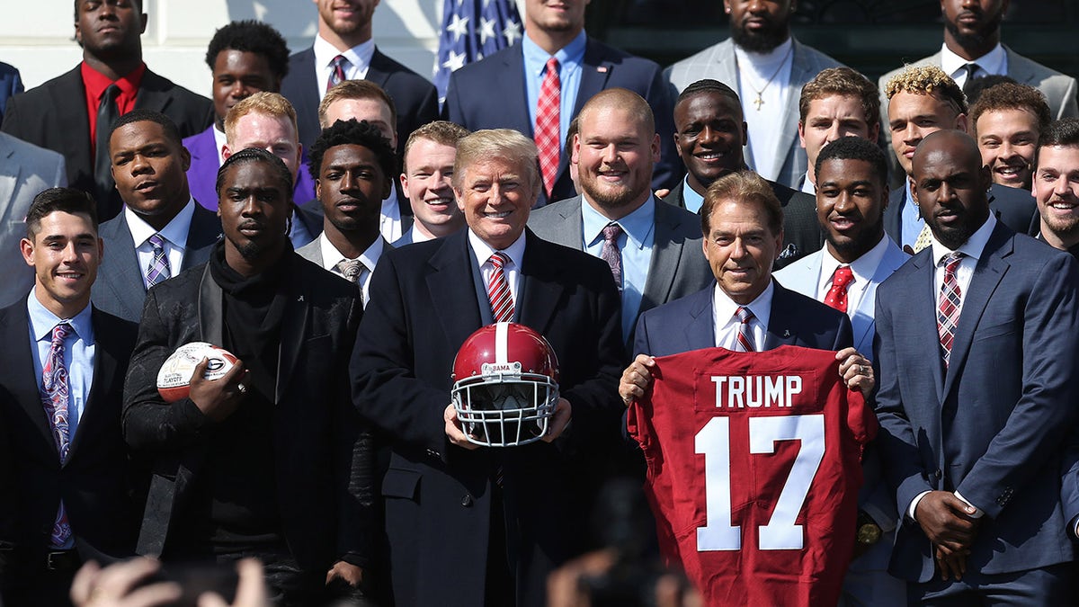 Donald Trump poses with Nick Saban