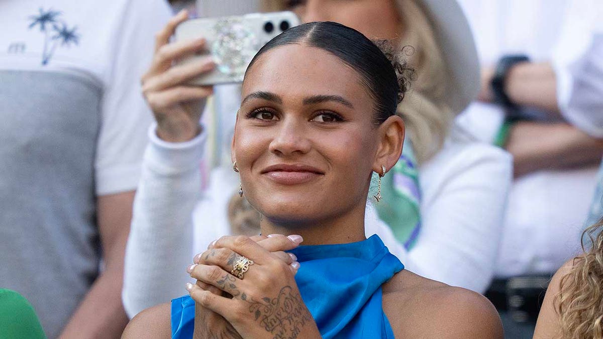 Trinity Rodman claps