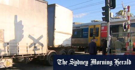 Train with 300 passengers crashes into truck in Brisbane