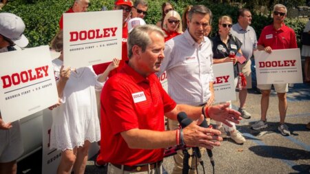 Gov. Brian Kemp endorses former football coach Derek Dooley outside Georgia stadium for 2026 US Senate bid