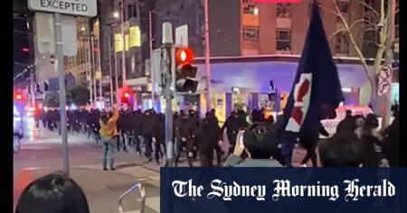 Neo-Nazis march in Melbourne CBD, given escort by police officers