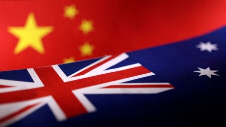 Australia warns against foreign interference after Chinese woman charged over monitoring Buddhist group