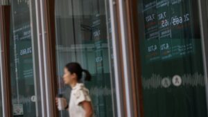 Asian markets diverge with eyes on Nvidia earnings