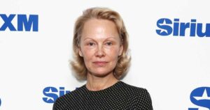 Pamela Anderson Jokes Go-To Date Night Look Is Trench Coat With Nothing Underneath
