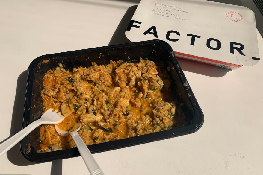 A fork and spoon in a chicken dish