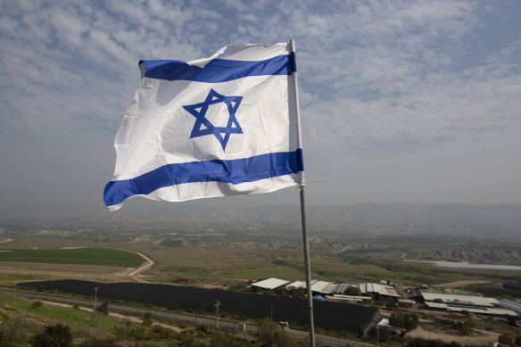 An Israeli flag flies outside a Jewish settlement in the West Bank. 