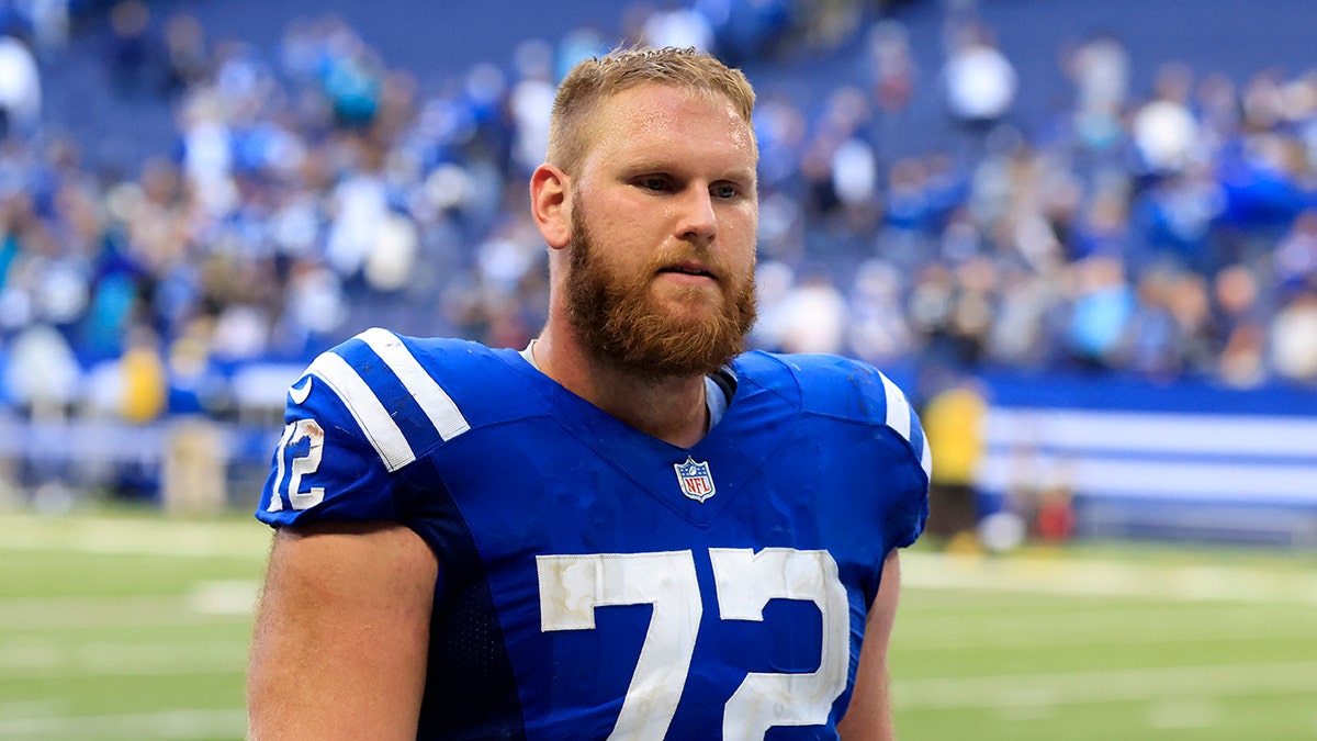 Braden Smith walks off the football field