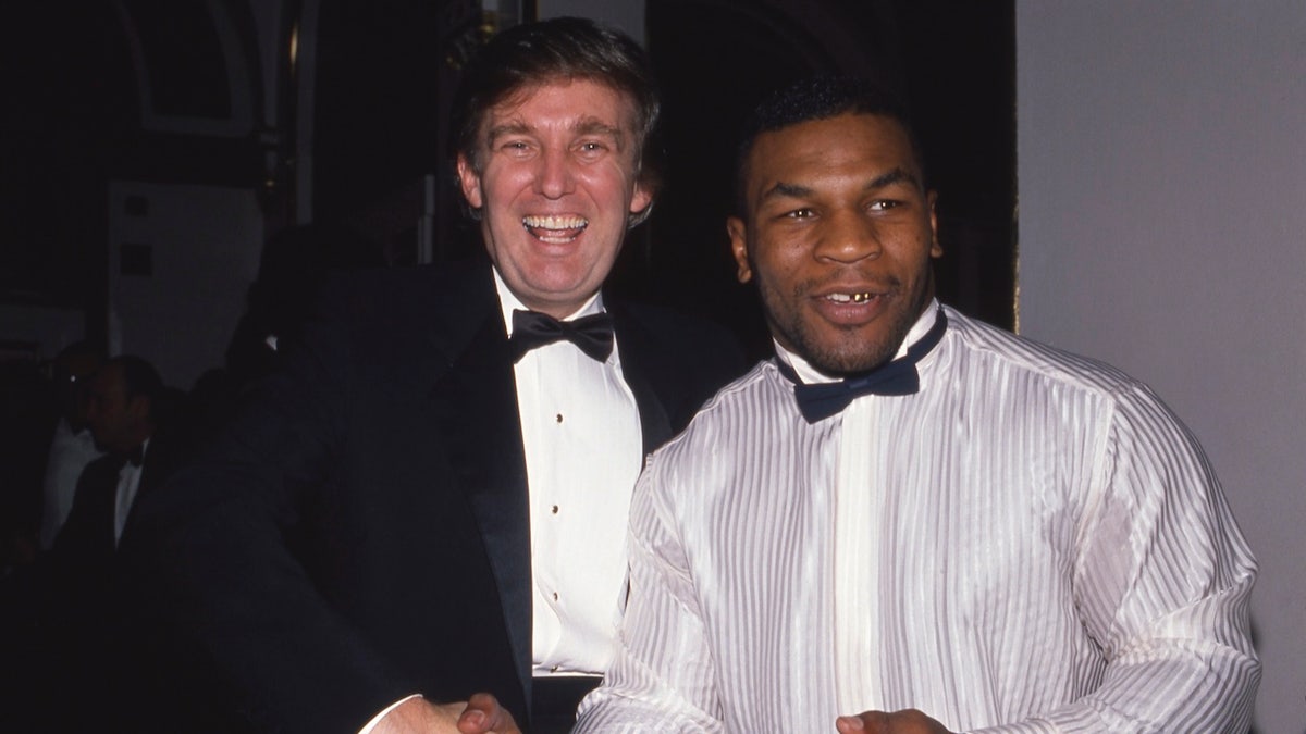 Donald Trump and Mike Tyson attend a March of Dimes dinner in November 1989 in New York City. 