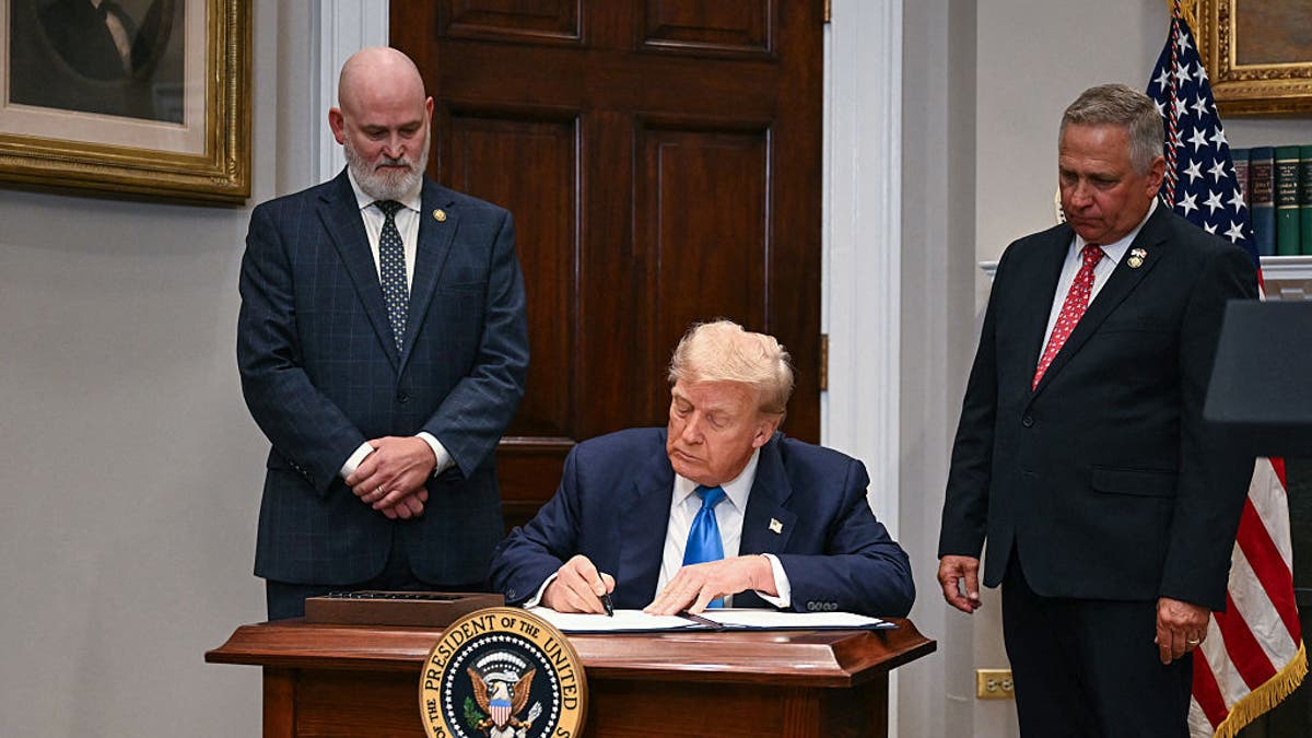 President Donald Trump signs the VA Home Loan Program Reform Act in the Roosevelt Room of the White House in Washington, July 30, 2025. (Jim Watson/AFP via Getty Images)