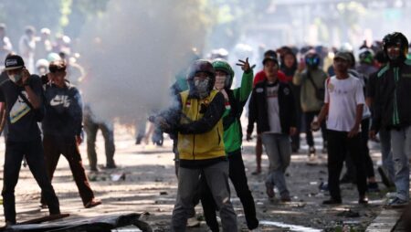 Indonesian police fire tear gas at protesters in Jakarta after driver’s death
