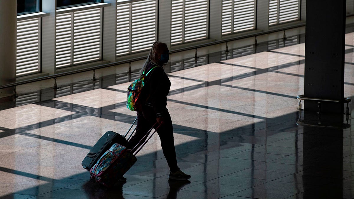 A woman walking in Josep Tarradellas Barcelona-El Prat Airport