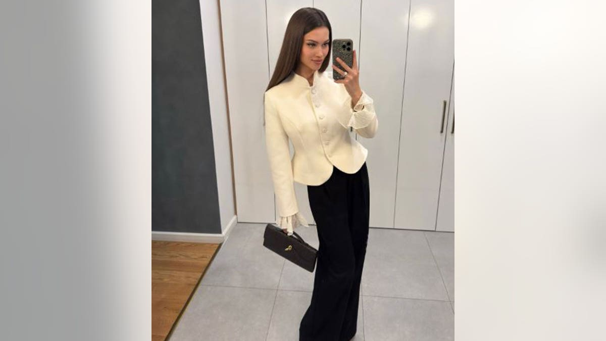 Kseniya Alexandrova taking a mirror selfie