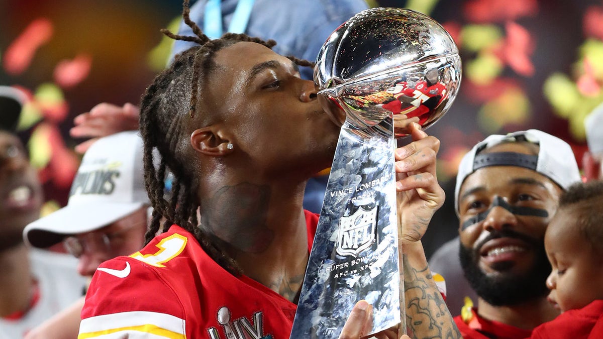 Demarcus Robinson with the trophy