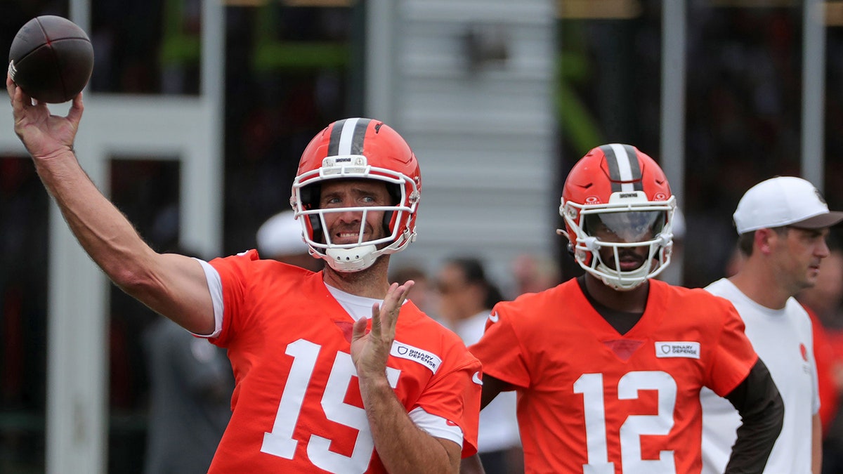 Joe Flacco throws as Shedeur Sanders looks on during Browns training camp July 25, 2025, in Berea, Ohio.