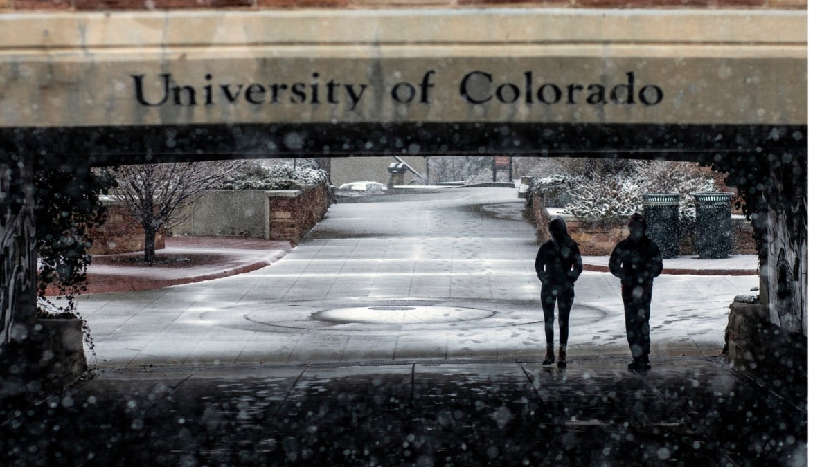 Students walk through the University of Colorado Boulder campus during a winter storm in Boulder, Colorado, U.S., on Saturday, March 13, 2021.