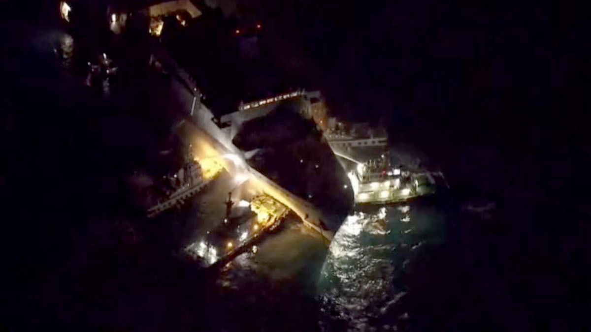 crews helping to extinguish fire aboard USS New Orleans