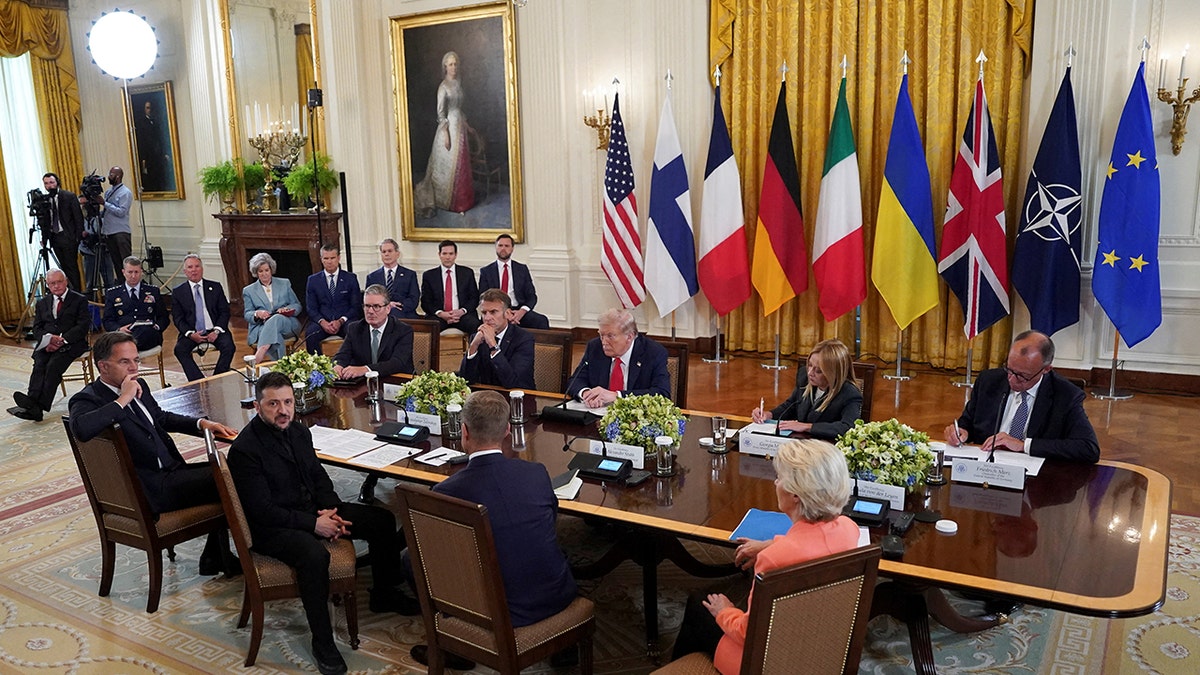 Ukrainian President Volodymyr Zelenskiy speaks during a meeting with U.S. President Donald Trump, German Chancellor Friedrich Merz, French President Emmanuel Macron, British Prime Minister Keir Starmer, Italian Prime Minister Giorgia Meloni, Finland's President Alexander Stubb, NATO Secretary General Mark Rutte and European Commission President Ursula von der Leyen amid negotiations to end the Russian war in Ukraine, at the White House in Washington, D.C., U.S., August 18, 2025.