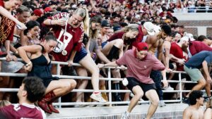 ACC fines Florida State ,000 under new policy after fans storm field following upset over Alabama