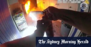 Dramatic vision shows moment officers rescue elderly woman in wheelchair from burning home