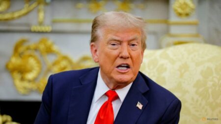 Trump signs order to lower US tariffs on Japan autos to 15%