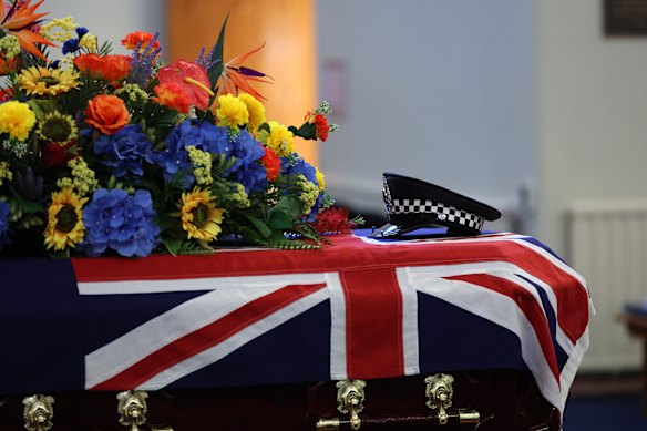 The police hat of Victoria Police officer Senior Constable Vadim De Waart sits on top of casket prior to his funeral service in Melbourne on Friday.