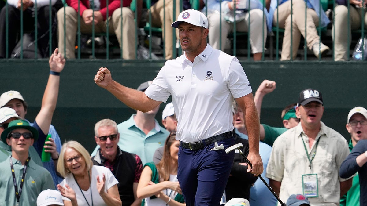 Bryson DeChambeau reacts after birdie