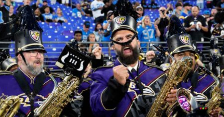 Jason Kelce Plays the Sax With the Baltimore Ravens Marching Band as Travis Kelce Cheers Him On