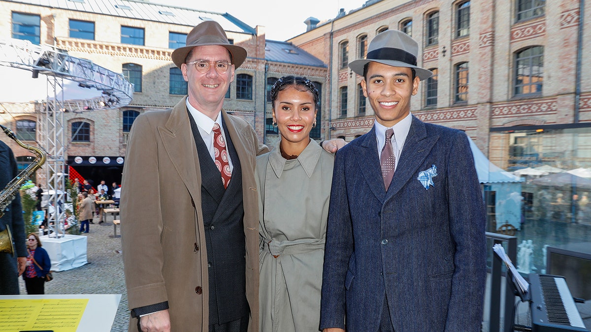 David Hermlin, right, poses with family at an event in Berlin.