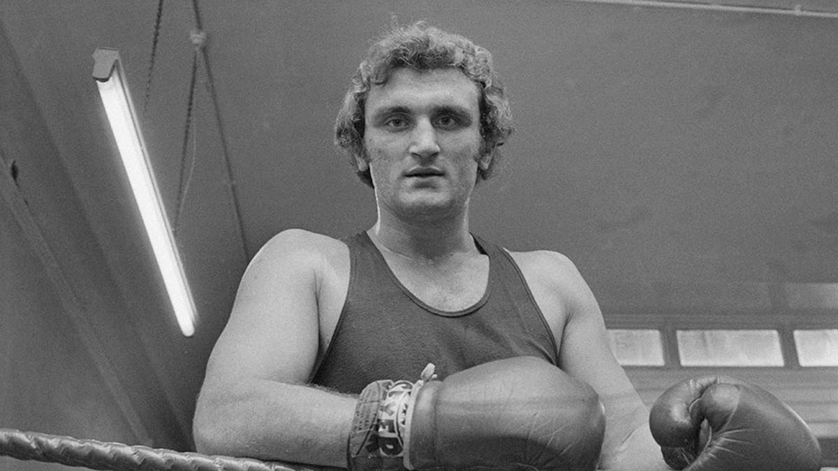 Joe Bugner looks on from ring
