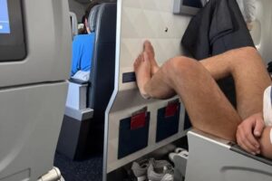 Flight passenger gets too comfortable on plane, sparking etiquette debate