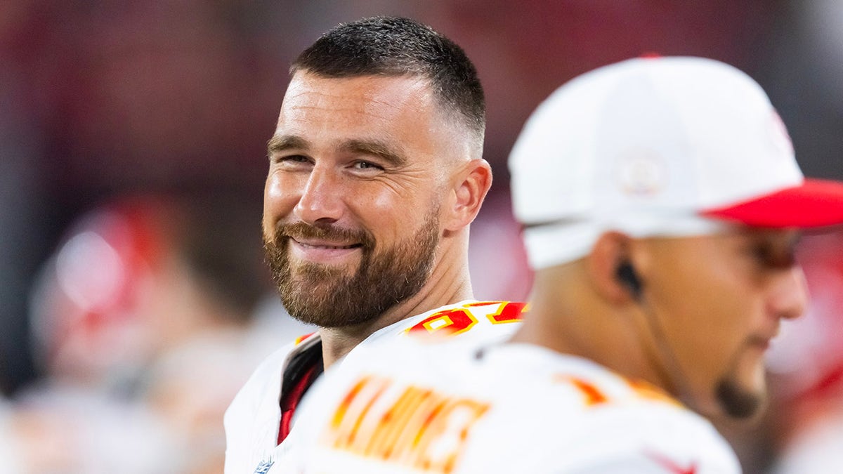 Travis Kelce smiles with Patrick Mahomes in frame
