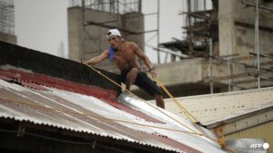 Tropical storm edges toward the Philippines and may grow to a typhoon on path toward China