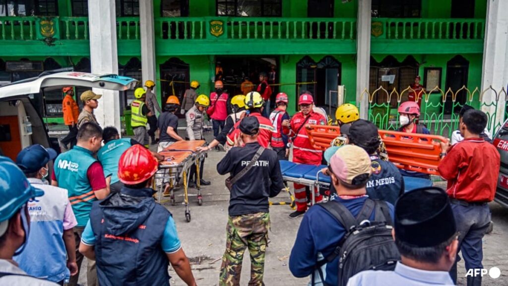 Two pulled from Indonesia school collapse as rescuers race against time